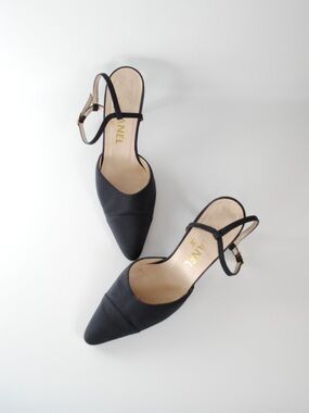 CHANEL Black Pointed Toe Slingback Heels with Gold Logo